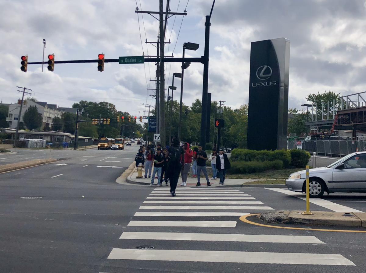 Students often walk into oncoming traffic at one of Alexandria's busiest intersections.